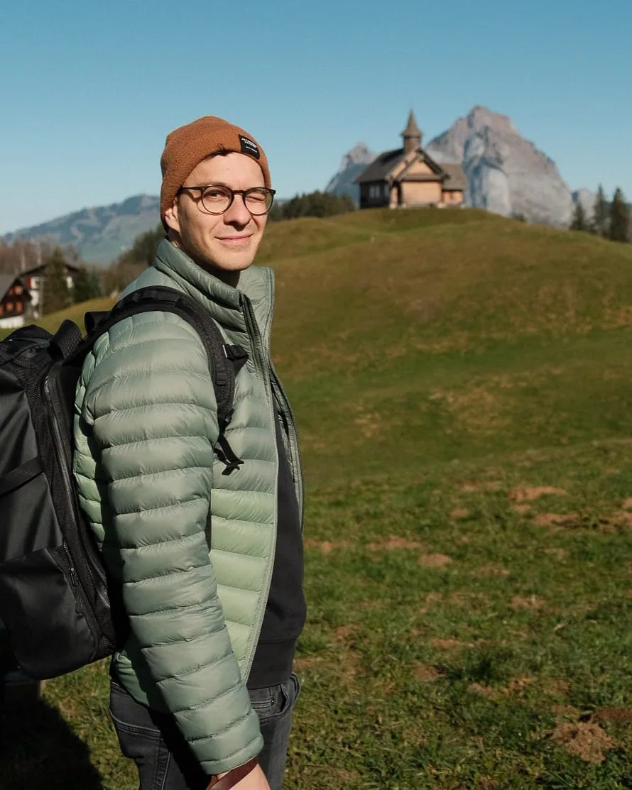 Rainer outdoors in an alpine meadow
